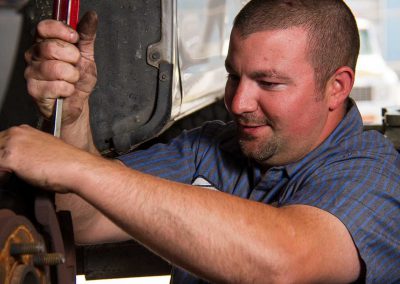 Derrick Repairing a Suspension Problem